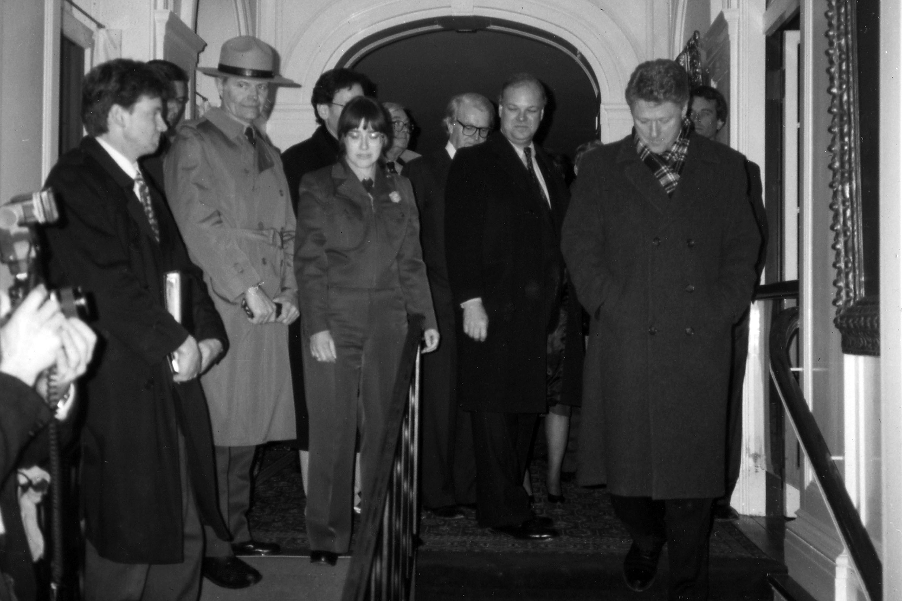 A group of people in the entryway to a house