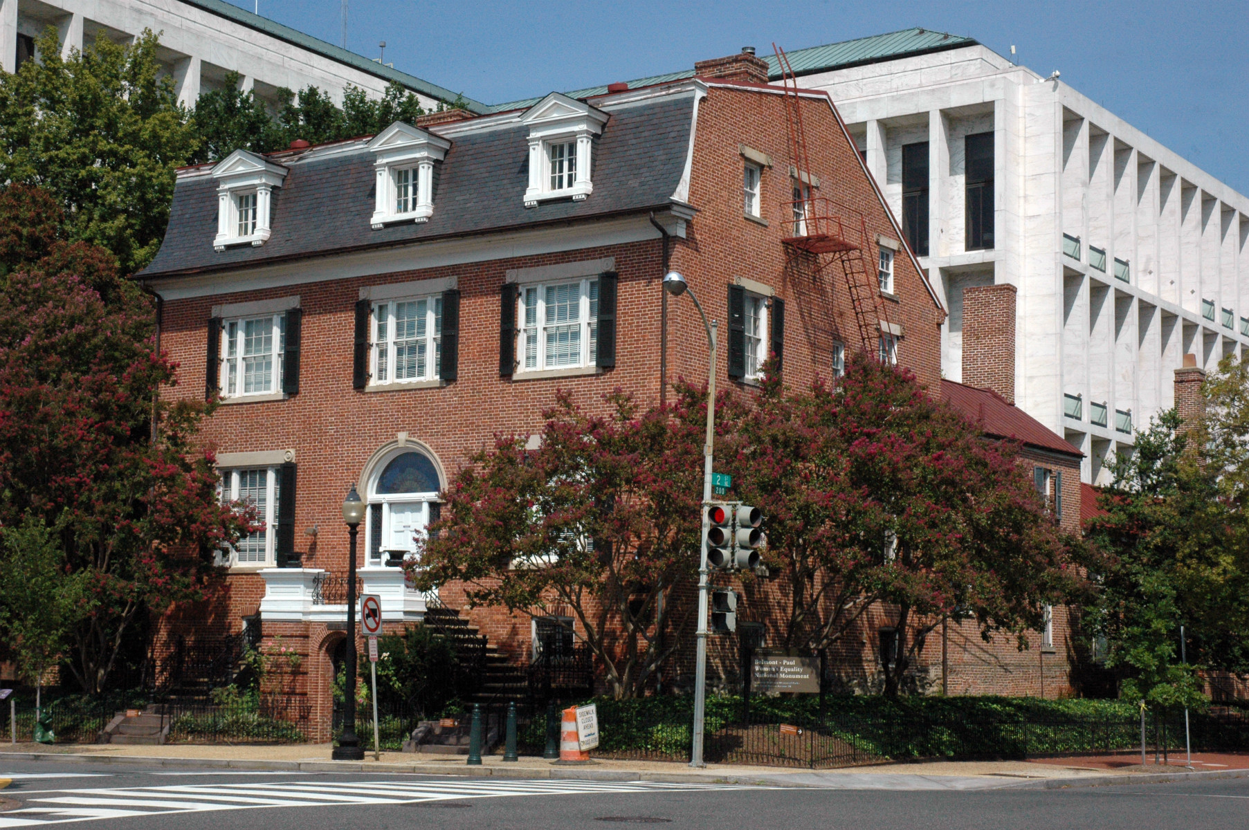 A red-bricked house on a street corner