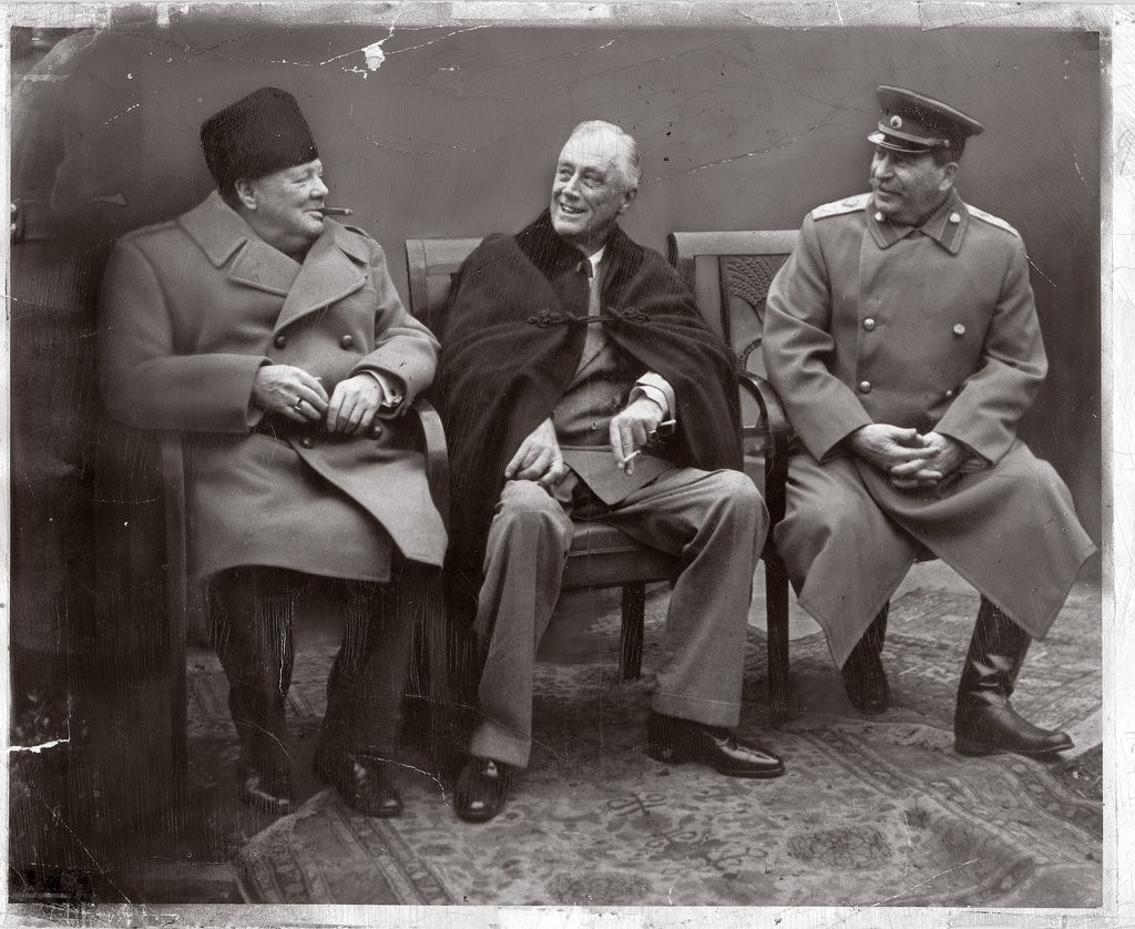 Churchill, Roosevelt, and Stalin at the Yalta Conference Three men, seated
