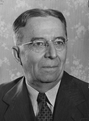 Dr. James Paullin A man wearing a suit