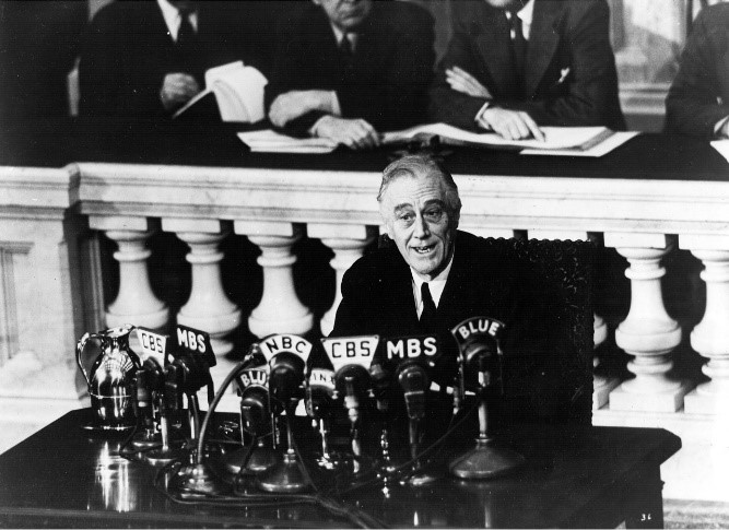 FDR speaking before a Joint Session of Congress on March 1st, 1945 A sick man speaks at a podium covered with microphones