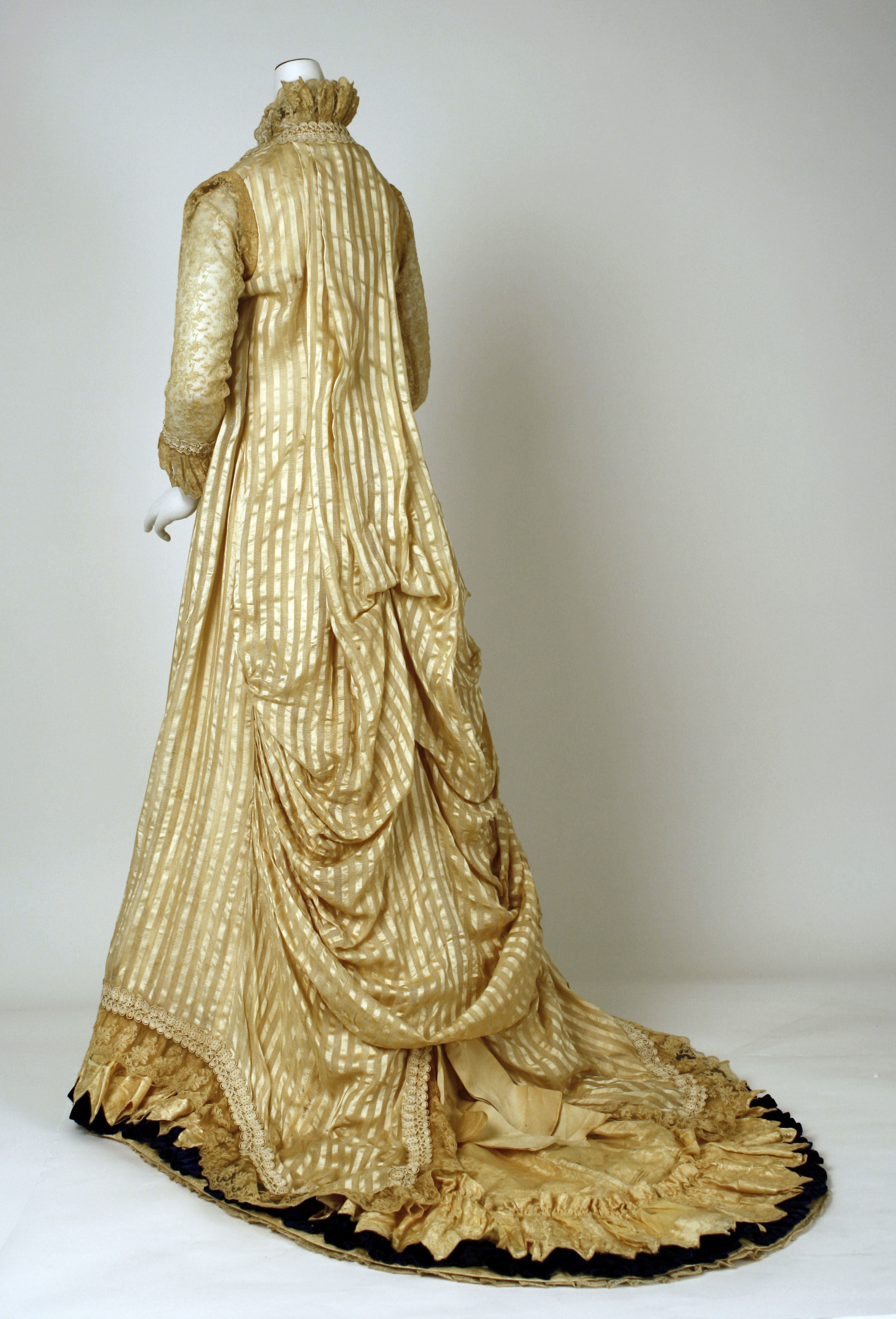 A long, loose-fitting gown from the back