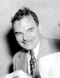 Thomas Dewey A grinning man in a suit