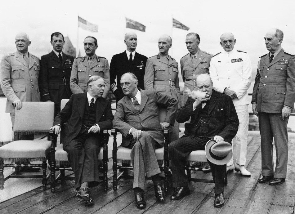 World Leaders at the Octagon Conference A group of men pose for a picture. Some are seated, others are standing
