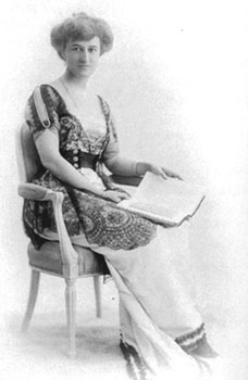 Beatrix Jones Farrand A woman sits in a chair with an open book in her lap
