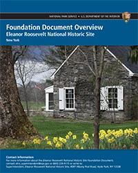 A report cover with image of stone house on green lawn with daffodils.
