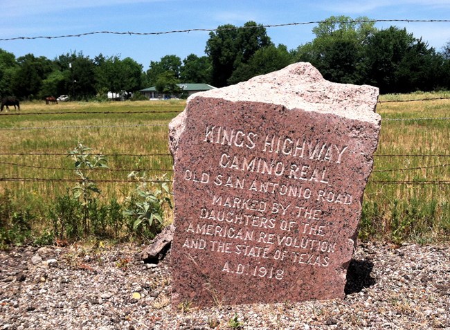 Stone marker, "Kings Highway El Camino Real, Old San Antonio Road, Marked by the Daughters of the American Revolution and the State of Texas.