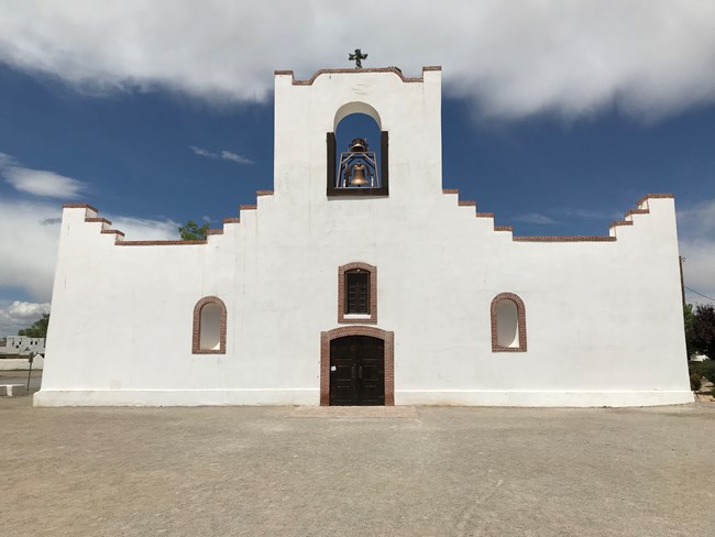 white church with bell in the middle