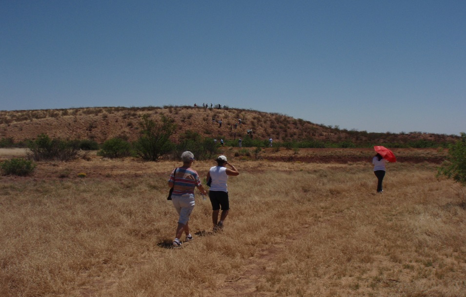 landscape of a trail and people walking