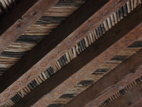 rows of cottonwood vigas, ceiling beams