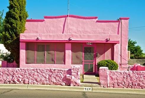 old spanish style home in pink