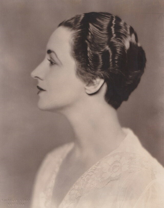 An portrait of a young women who is elegantly dressed.