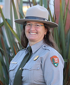 Female park ranger in uniform.