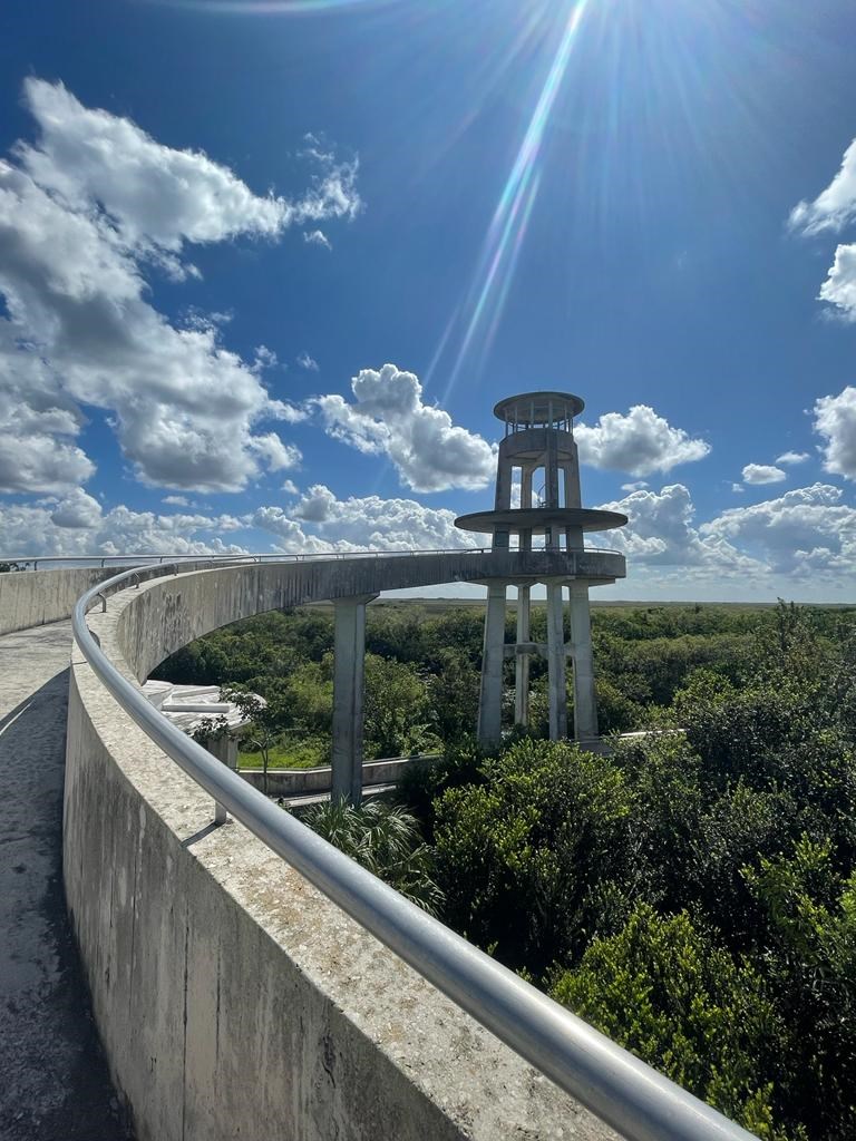 A tall concrete tower with a ramp leading to it