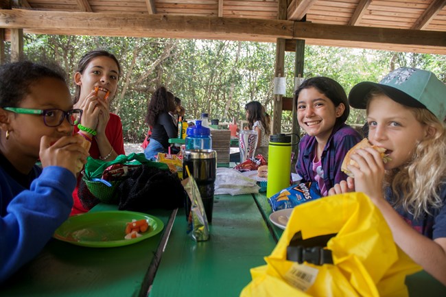 Students enjoying a meal at Hidden Lake Camp Site