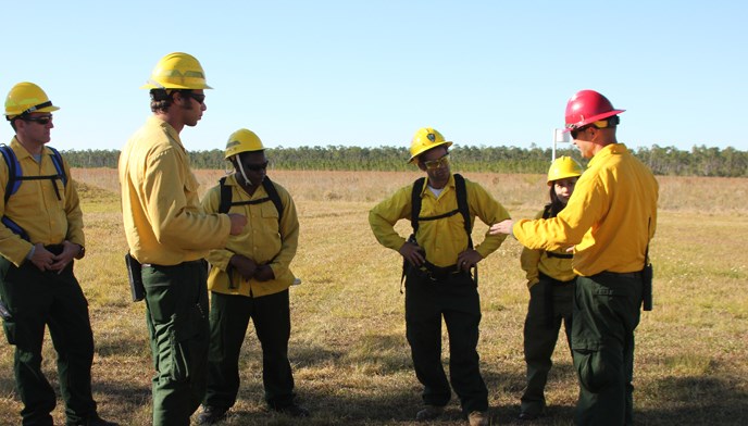 Incident Commander briefs firefighters.