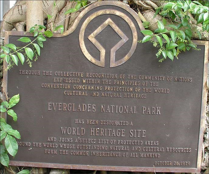 Bronze sign outside of Coe Visitor Center showing the designation of Everglades NP as a World Heritage Site.