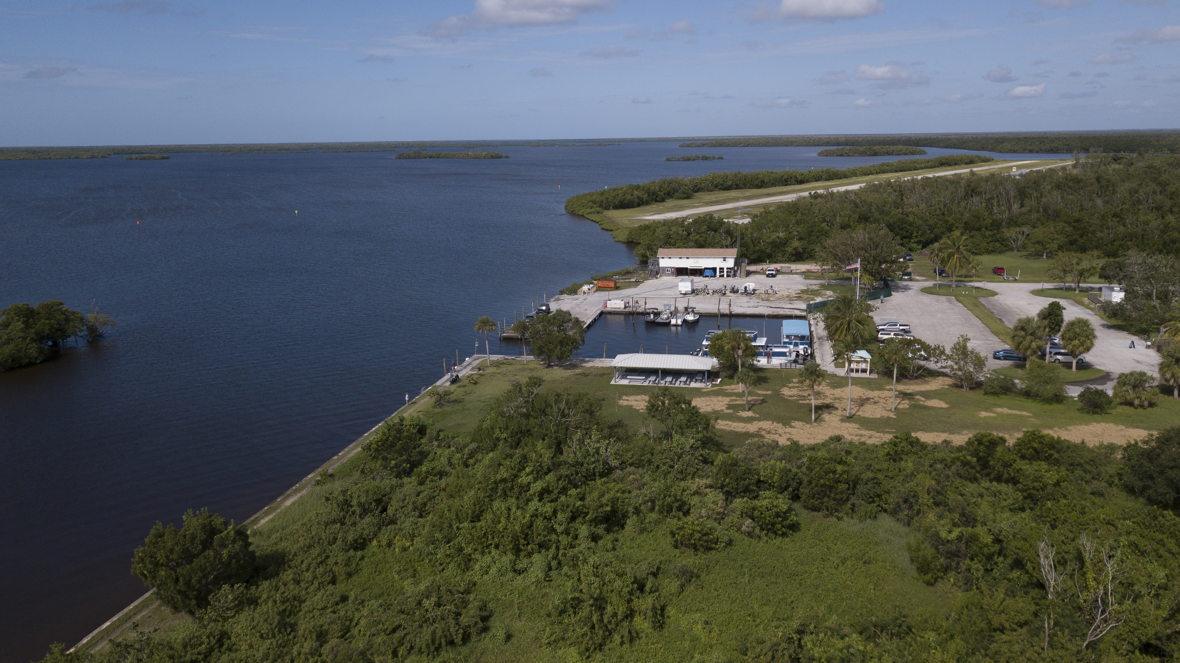 Gulf Coast visitor area in Everglades National Park Aerial view shows a small developed area with boat basin and parking lot along the coastline of a bay with mangrove islands