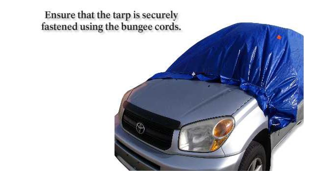 Ensure that the tarp is securely fastened using the bungee cords.