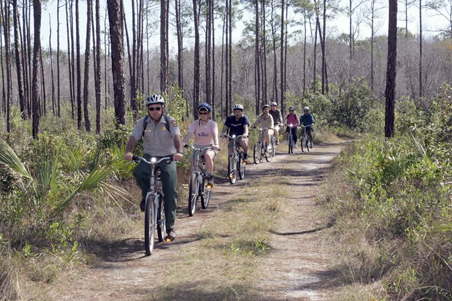 A ranger leading a bicycle hike