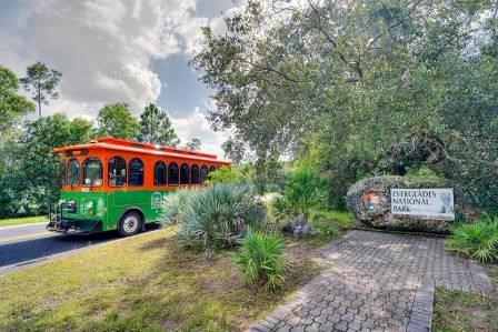 the national park trolley passing the Everglades National Park entrance sign