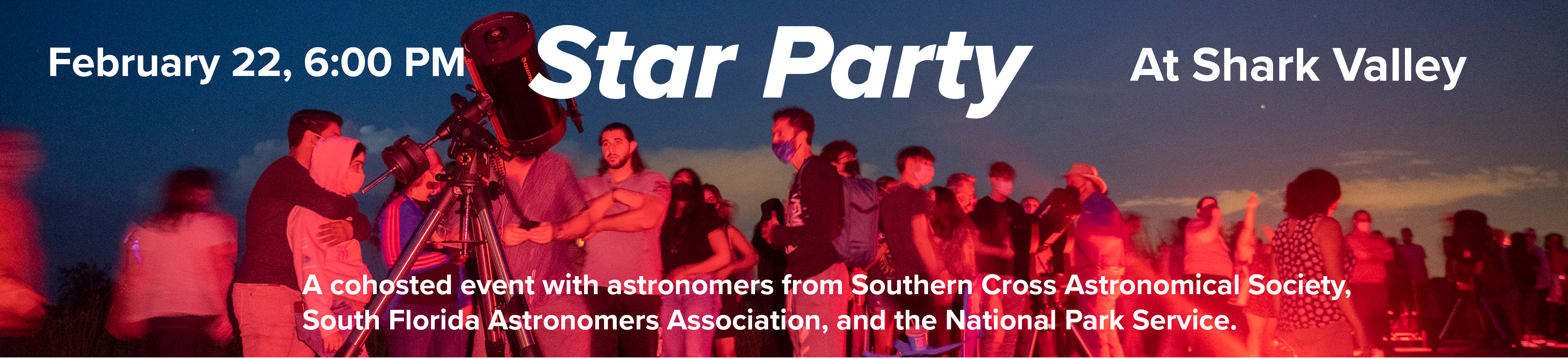 Visitors use a telescope to look at the night sky