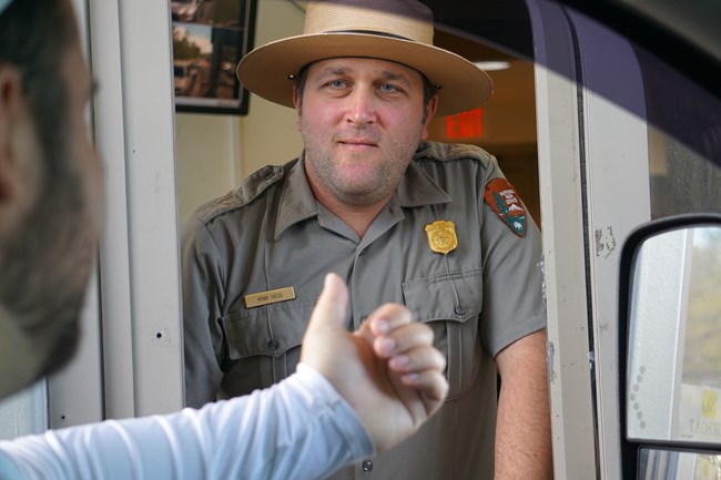 Fee Collection Ranger at Entrance Station