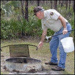 Campground Host Cleaning Fire Rings
