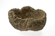 Rock with hole worn in it.
