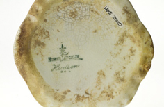 Bottom of aged pitcher.