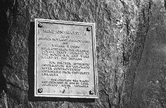 Plaque bolted on large rock.
