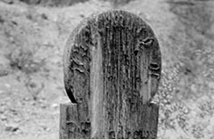 Aged wooden grave marker.