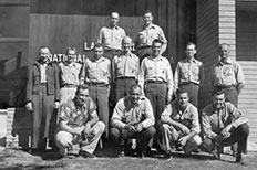Rangerforce consisting of thirteen men pose together for a photo in front of the Lake Mead National Recreation Area sign.