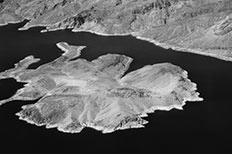 Aerial view of Island of complex shape, other hills in backgroud.