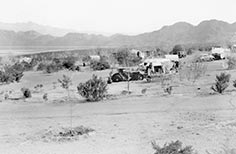 Campground with trucks and trailers.