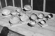 Pottery bowls with patterns on them sitting on a table.