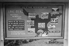 Overlook display of the National Recreation Area with scattered pictures. 