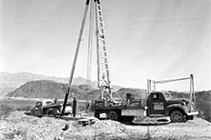 Large A frame lifting rig mounted to rear of truck.