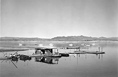 Boats nearby dock on a lake.