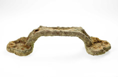 Aged handle with sediment buildup on it.