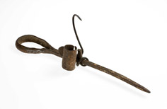 Aged metal candle holder.