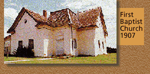First Baptist Church, built in 1907, is a large white structure, with multiple wings.