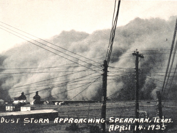 A massive dust cloud with handwritten caption, Dust Storm Approaching Spearman, Texas, April 14, 1935.