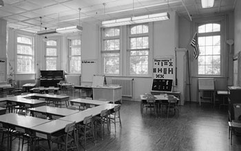 School classroom filled with desks.