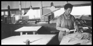 A man busy at work in the camp technical building.