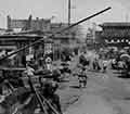 A crowded road in China during the Boxer Rebellion.