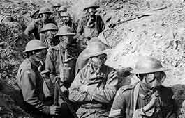 Soldiers wearing gas masks in a trench during World War I.