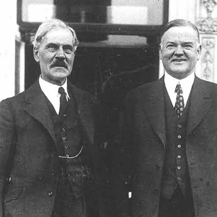 Ramsay MacDonald standing with Herbert Hoover.