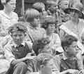 Children gathered on the steps of the Mountain School with Lou Henry Hoover.