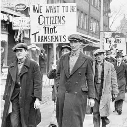 Picketers marching with sign that reads, We Want to Be Citizens Not Transients